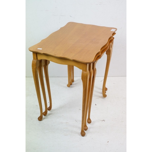 583 - Nest of Three Teak Table with shaped tops and cabriole legs, largest 56cm wide x 54cm high