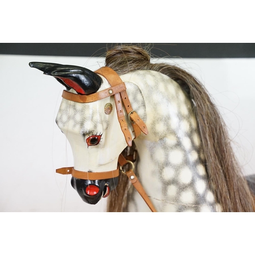 663 - Wooden Painted Dapple Grey Rocking Horse with leather bridle and saddle held on a pine treadle base,... 