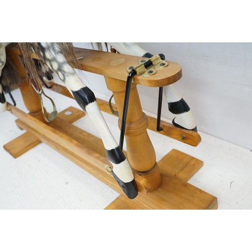 663 - Wooden Painted Dapple Grey Rocking Horse with leather bridle and saddle held on a pine treadle base,... 