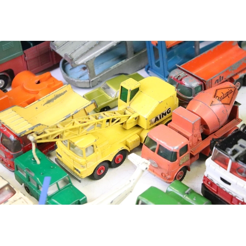 1274 - Around 35 mid 20th C play worn diecast models to include Dinky, Corgi and Matchbox, featuring Corgi ... 