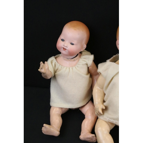 340 - Four early 20th C Armand Marseille bisque headed dolls with glass eyes & painted facial features, th... 