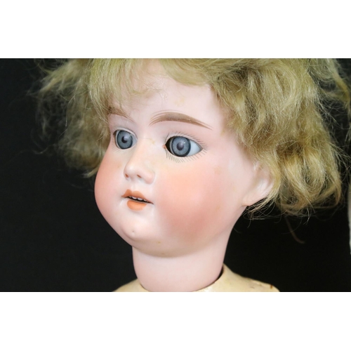 340 - Four early 20th C Armand Marseille bisque headed dolls with glass eyes & painted facial features, th... 