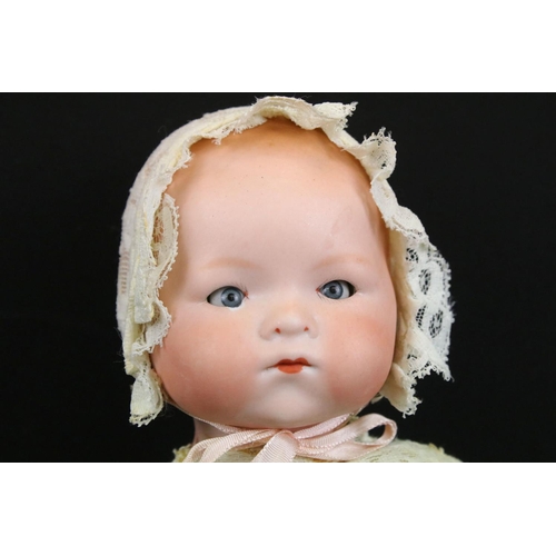 340 - Four early 20th C Armand Marseille bisque headed dolls with glass eyes & painted facial features, th... 