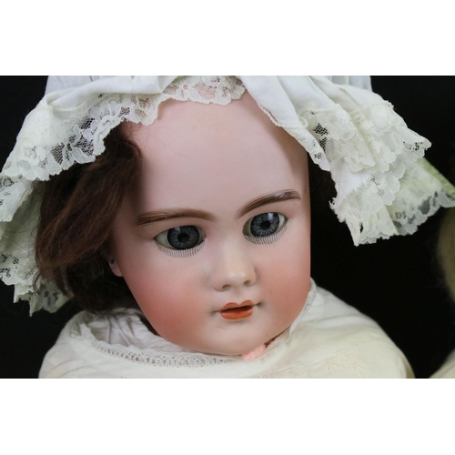 341 - Two early 20th C bisque headed dolls with glass sleeping eyes, open mouths, painted facial features ... 