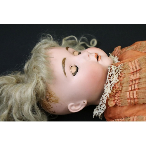 341 - Two early 20th C bisque headed dolls with glass sleeping eyes, open mouths, painted facial features ... 