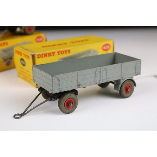 1371 - Four boxed Dinky 428 Trailer (large) diecast models all in grey with red hubs, showing play wear, bo... 