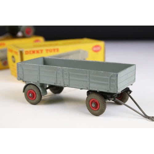 1371 - Four boxed Dinky 428 Trailer (large) diecast models all in grey with red hubs, showing play wear, bo... 