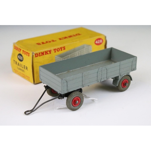 1371 - Four boxed Dinky 428 Trailer (large) diecast models all in grey with red hubs, showing play wear, bo... 