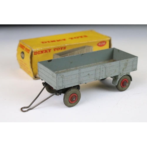 1371 - Four boxed Dinky 428 Trailer (large) diecast models all in grey with red hubs, showing play wear, bo... 