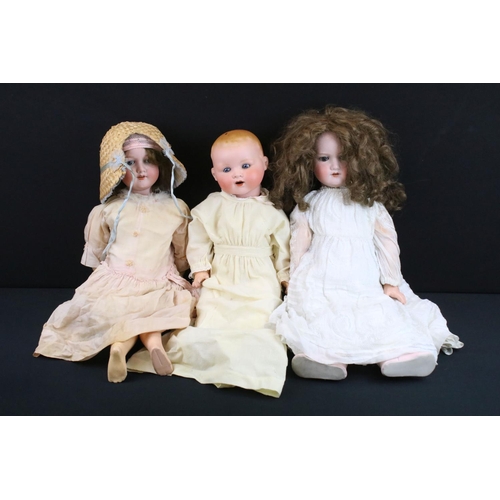 345 - Three early 20th C Armand Marseille bisque headed dolls with glass sleeping eyes, open mouths, paint... 