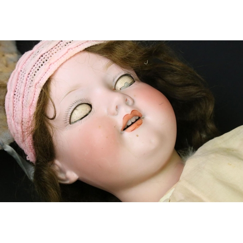 345 - Three early 20th C Armand Marseille bisque headed dolls with glass sleeping eyes, open mouths, paint... 