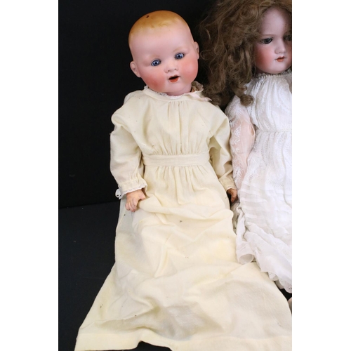 345 - Three early 20th C Armand Marseille bisque headed dolls with glass sleeping eyes, open mouths, paint... 