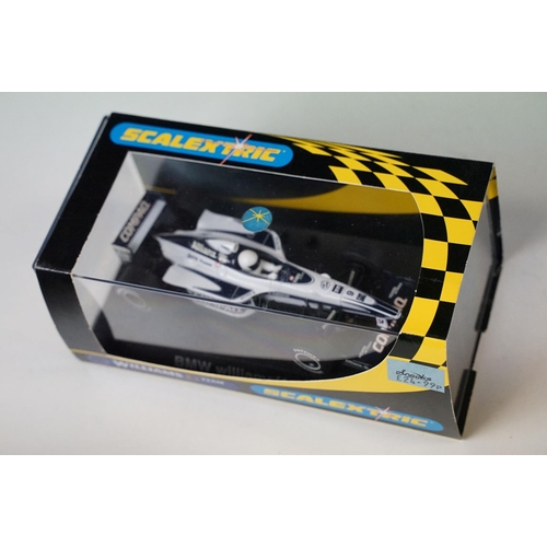 272 - Four boxed / cased Scalextric slot cars to include C143 Williams Renault FW 15C, C403 Ford Escort Co... 