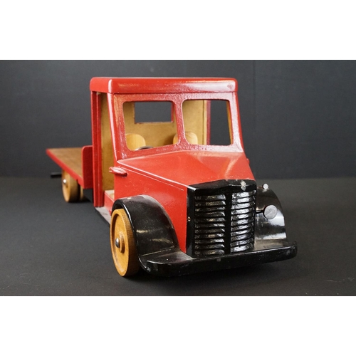 285 - Two scratch built painted wooden models to include flat bed truck with red cab and wooden slatted ef... 