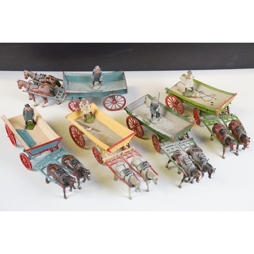 338 - Group of five mid 20th C painted metal Britains horses with carts / farm wagons, each with Britains ... 