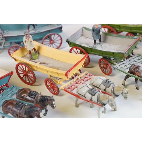 338 - Group of five mid 20th C painted metal Britains horses with carts / farm wagons, each with Britains ... 