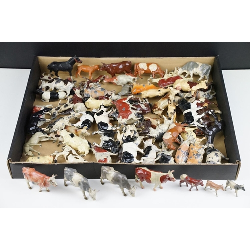 321 - Collection of around 80 various Mid 20th C Britains metal Farm animals to include mainly cows, calfs... 