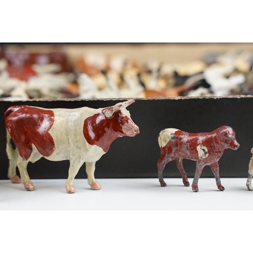 321 - Collection of around 80 various Mid 20th C Britains metal Farm animals to include mainly cows, calfs... 