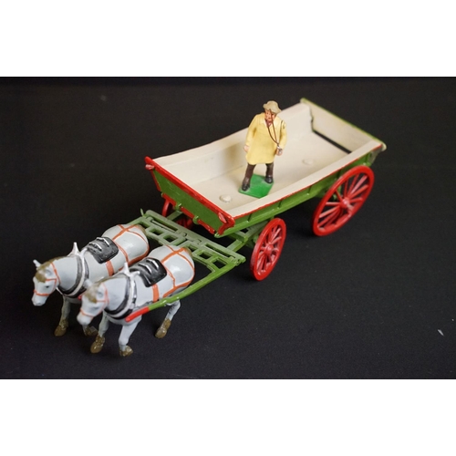 336 - Collection of ten mid 20th C painted metal Britains horses with carts / farm wagons, each with Brita... 