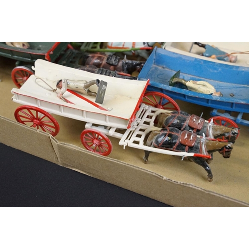 336 - Collection of ten mid 20th C painted metal Britains horses with carts / farm wagons, each with Brita... 