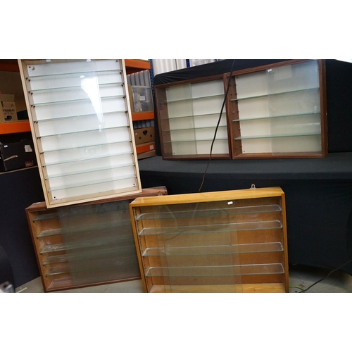 1257A - Collection of eight wall mounted wooden display cabinets with sliding glass fronts & glass shelves, ... 