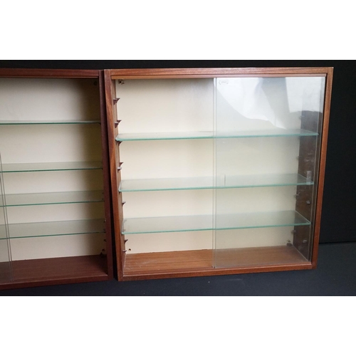 1257A - Collection of eight wall mounted wooden display cabinets with sliding glass fronts & glass shelves, ... 