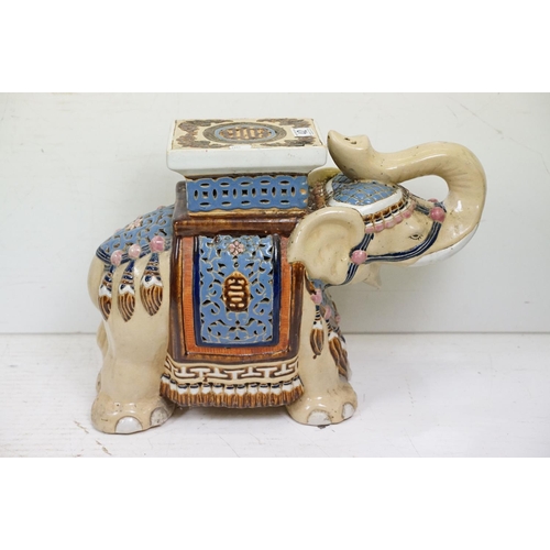 42 - Pair of Chinese ceramic elephant stools modelled with trunks aloft, with blue, pink & brown glazed d... 