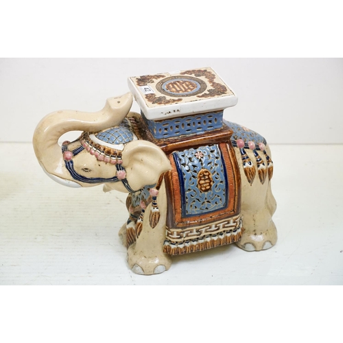 42 - Pair of Chinese ceramic elephant stools modelled with trunks aloft, with blue, pink & brown glazed d... 