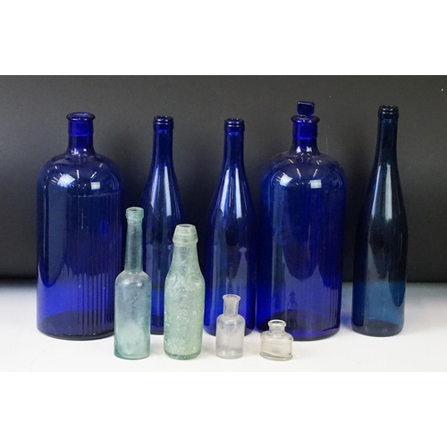 52 - Collection of nine vintage glass bottles to include blue poison bottles, J.B. Bowler of Bath Codd bo... 