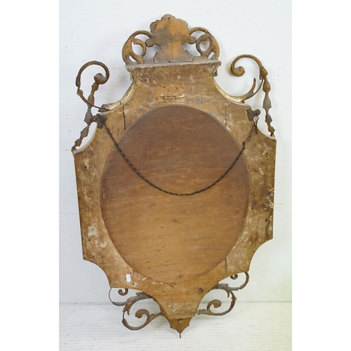 551 - Antique Giltwood and Gesso Framed Shaped Mirror in the Rococo style with oval bevelled plate, 95cm x... 