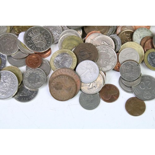 318 - A collection of mixed British and world coins to include pre decimal examples.