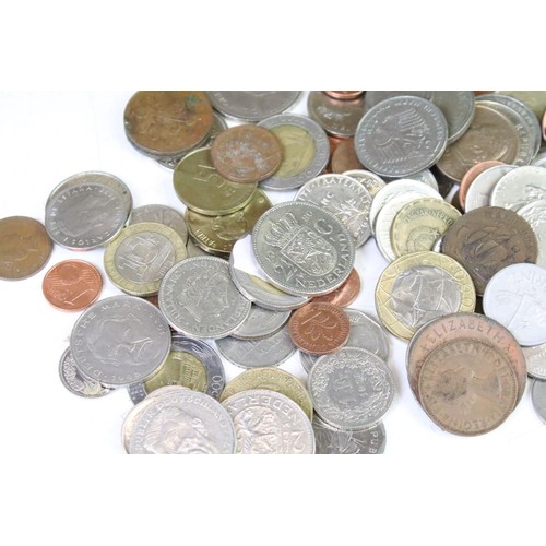 318 - A collection of mixed British and world coins to include pre decimal examples.