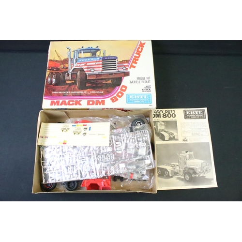 197 - Three boxed plastic model kits to include Tamiya 1/20 GC2002 McLaren M23, ertl 1/25 Mack DM800 Truck... 