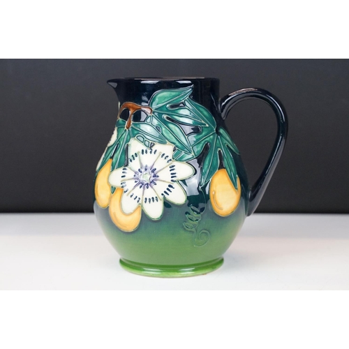 10 - Moorcroft Pottery 'Passion Fruit' pattern baluster jug, on a blue-green graduated ground, date mark ... 