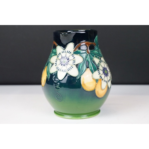 10 - Moorcroft Pottery 'Passion Fruit' pattern baluster jug, on a blue-green graduated ground, date mark ... 