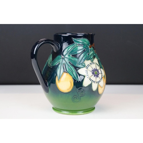 10 - Moorcroft Pottery 'Passion Fruit' pattern baluster jug, on a blue-green graduated ground, date mark ... 