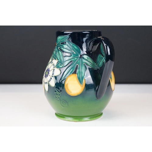 10 - Moorcroft Pottery 'Passion Fruit' pattern baluster jug, on a blue-green graduated ground, date mark ... 