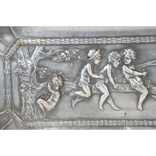 114 - Helmuth Schievelkamp for WMF (1849-1932) - A plated metal tray with repousse decoration of children ... 