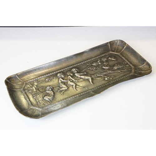 114 - Helmuth Schievelkamp for WMF (1849-1932) - A plated metal tray with repousse decoration of children ... 