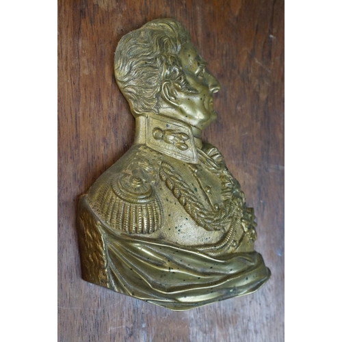 116 - 19th Century Duke of Wellington gilt metal profile, mounted on a rosewood panel. Measures approx 25.... 