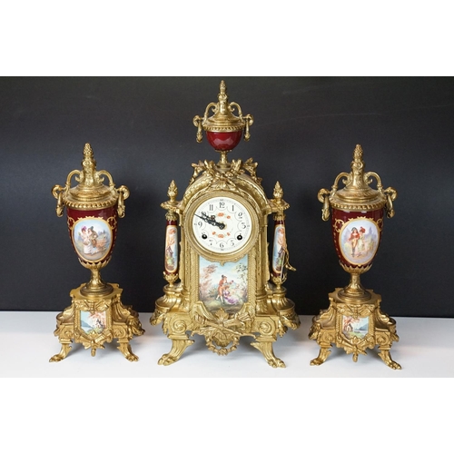 121 - Late 20th Century Franz Hermle Lancini brass clock garniture with ceramic panelling, the clock dial ... 