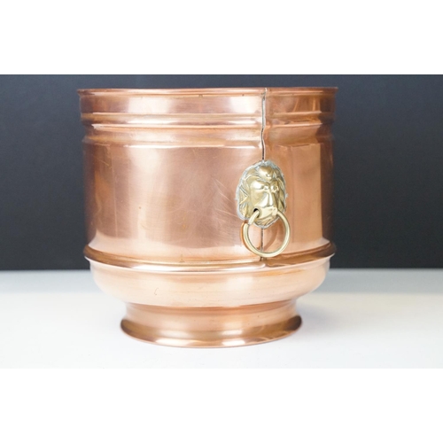 122 - Copper Circular Planter / Jardiniere with brass lion mask ring handles, 16cm high