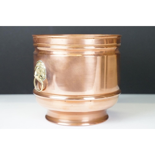 122 - Copper Circular Planter / Jardiniere with brass lion mask ring handles, 16cm high