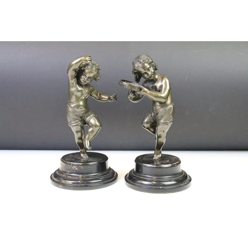 132 - Pair of neoclassical cast bronze figures in the form of children dancing with instruments. both rais... 