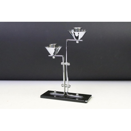 137 - Art Deco Chrome Two Branch Candlestick on a black glass base, 23cm high