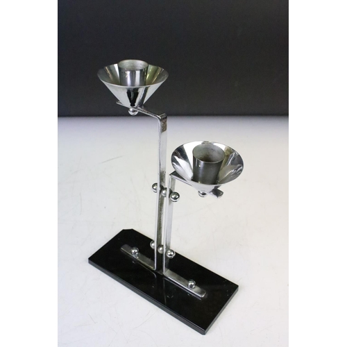 137 - Art Deco Chrome Two Branch Candlestick on a black glass base, 23cm high