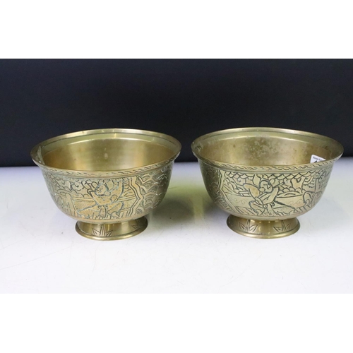 148 - Pair of Chinese brass footed bowls each with incised warrior decoration to the sides and with Xuande... 