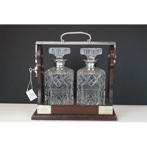 160 - Early-to-mid 20th C wooden tantalus with silver plated mounts & handle, marked 'PB & S', housing a p... 