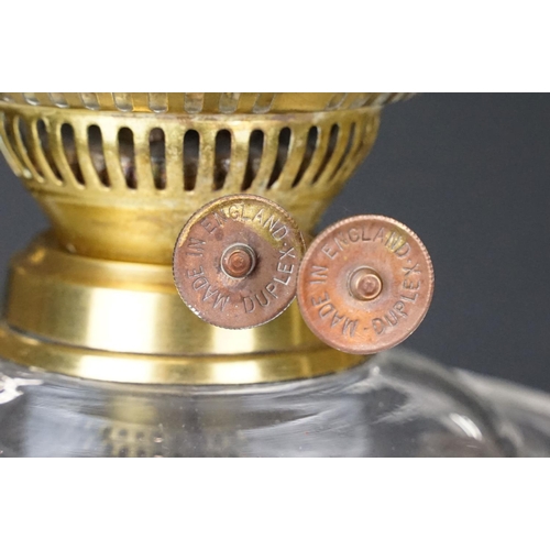 168 - 19th Century Victorian oil lamp having a fluted brass base, faceted glass reservoir, with fanned rim... 