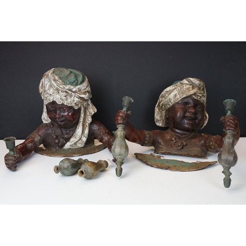 173 - Pair of 19th Century cast metal figural wall sconces in the form of African children, each holding a... 